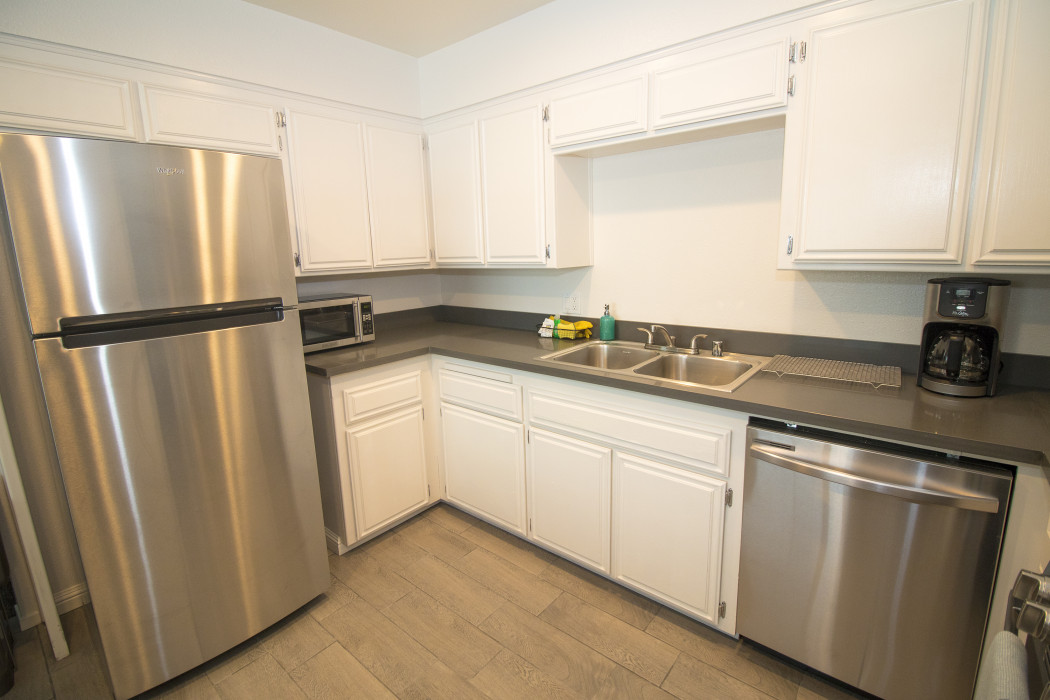 You'll find a full sized fridge in our fully equipped Two Bedroom Kitchen Suite.